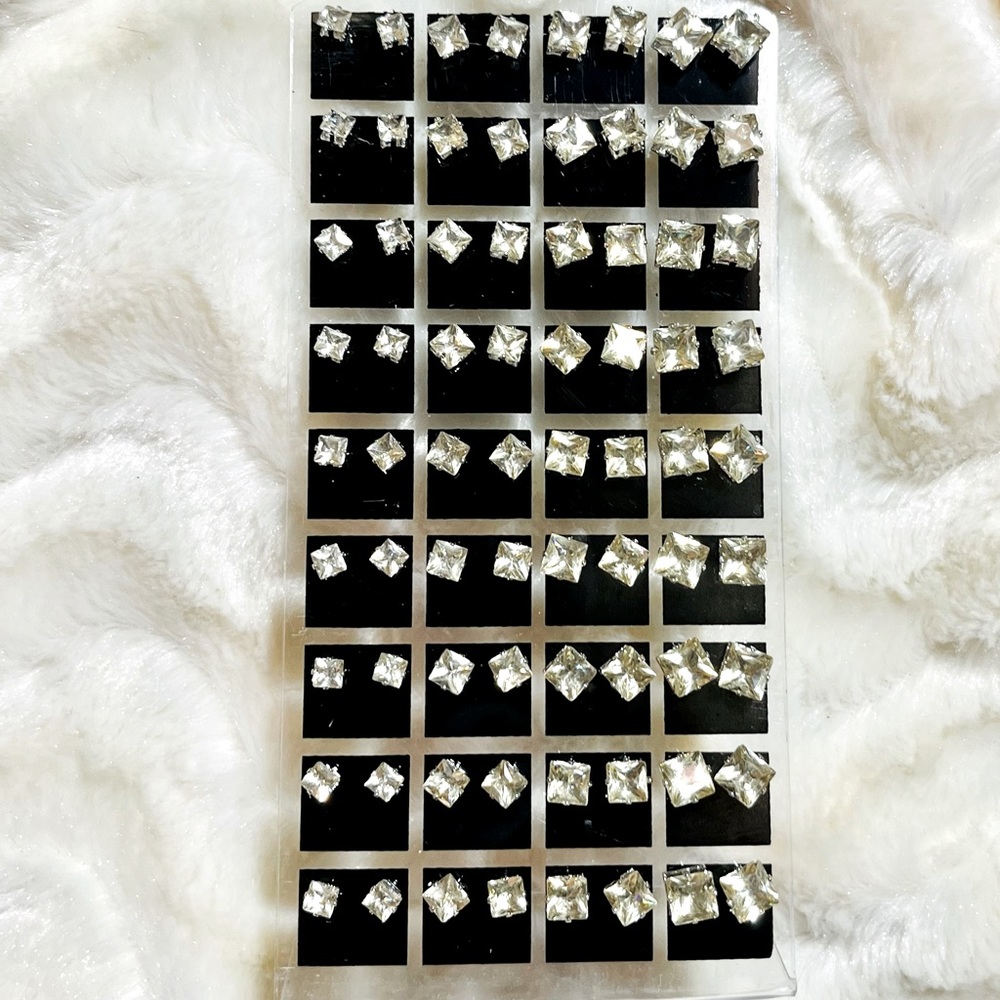 Brand new 36 pair rhinestone earrings on stand Great for resale